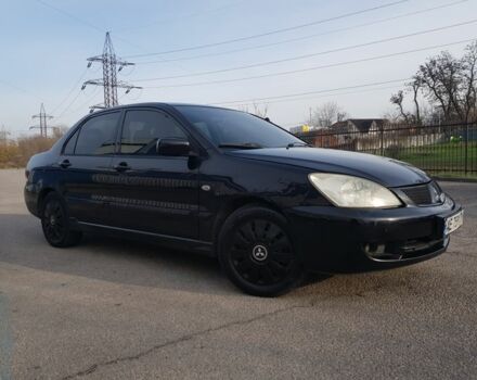 Черный Мицубиси Лансер, объемом двигателя 1.6 л и пробегом 290 тыс. км за 3200 $, фото 1 на Automoto.ua