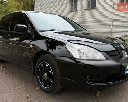 Чорний Міцубісі Lancer, об'ємом двигуна 1.58 л та пробігом 386 тис. км за 4450 $, фото 7 на Automoto.ua