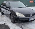 Чорний Міцубісі Lancer, об'ємом двигуна 1.58 л та пробігом 310 тис. км за 2850 $, фото 1 на Automoto.ua