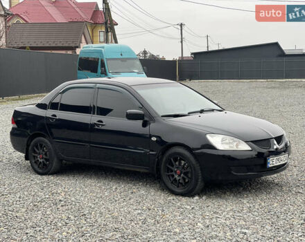 Чорний Міцубісі Lancer, об'ємом двигуна 1.58 л та пробігом 230 тис. км за 3350 $, фото 4 на Automoto.ua