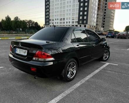 Чорний Міцубісі Lancer, об'ємом двигуна 1.58 л та пробігом 329 тис. км за 3500 $, фото 3 на Automoto.ua