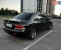 Чорний Міцубісі Lancer, об'ємом двигуна 1.58 л та пробігом 329 тис. км за 3500 $, фото 3 на Automoto.ua