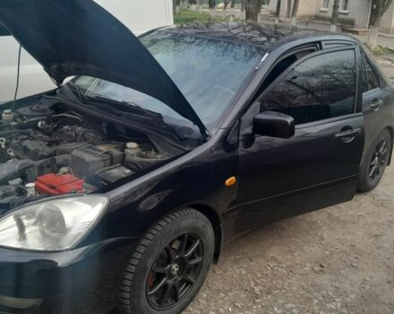 Черный Мицубиси Лансер, объемом двигателя 1.6 л и пробегом 260 тыс. км за 3800 $, фото 7 на Automoto.ua