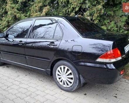 Черный Мицубиси Лансер, объемом двигателя 1.58 л и пробегом 246 тыс. км за 4200 $, фото 5 на Automoto.ua