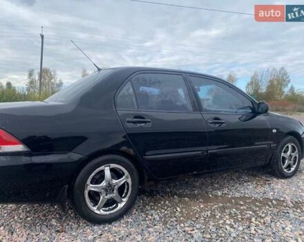 Чорний Міцубісі Lancer, об'ємом двигуна 1.6 л та пробігом 335 тис. км за 3500 $, фото 5 на Automoto.ua
