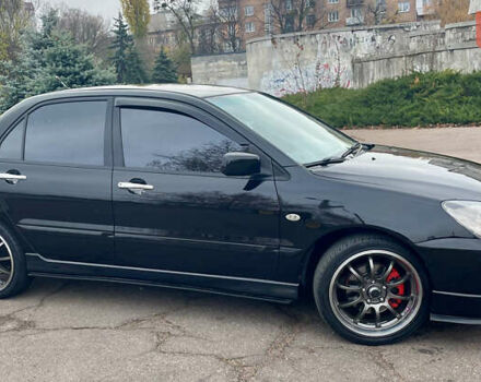 Чорний Міцубісі Lancer, об'ємом двигуна 2 л та пробігом 242 тис. км за 5900 $, фото 2 на Automoto.ua