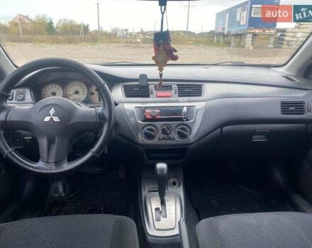 Чорний Міцубісі Lancer, об'ємом двигуна 1.6 л та пробігом 335 тис. км за 3500 $, фото 7 на Automoto.ua