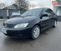 Чорний Міцубісі Lancer, об'ємом двигуна 1.58 л та пробігом 196 тис. км за 3800 $, фото 1 на Automoto.ua