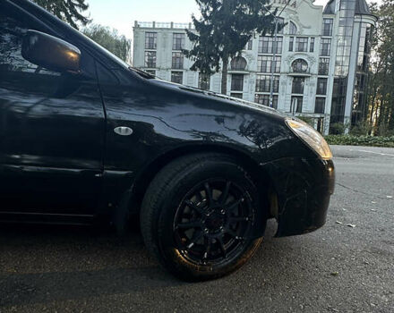 Черный Мицубиси Лансер, объемом двигателя 1.6 л и пробегом 233 тыс. км за 3650 $, фото 7 на Automoto.ua