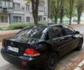 Черный Мицубиси Лансер, объемом двигателя 1.6 л и пробегом 270 тыс. км за 4266 $, фото 1 на Automoto.ua