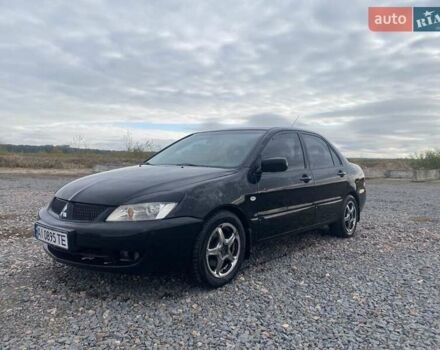 Чорний Міцубісі Lancer, об'ємом двигуна 1.6 л та пробігом 335 тис. км за 3500 $, фото 11 на Automoto.ua