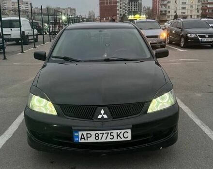 Черный Мицубиси Лансер, объемом двигателя 2 л и пробегом 238 тыс. км за 6000 $, фото 2 на Automoto.ua