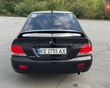 Черный Мицубиси Лансер, объемом двигателя 1.59 л и пробегом 221 тыс. км за 4200 $, фото 2 на Automoto.ua