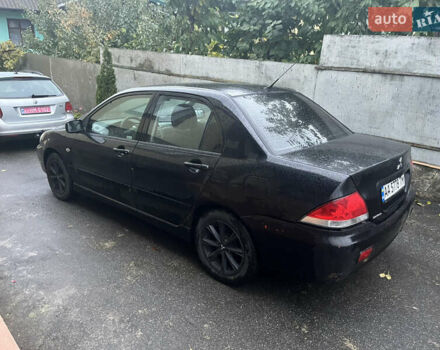 Черный Мицубиси Лансер, объемом двигателя 1.58 л и пробегом 250 тыс. км за 2450 $, фото 2 на Automoto.ua