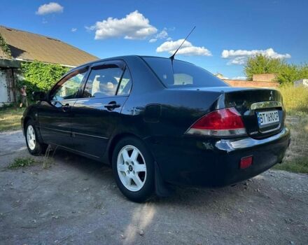 Черный Мицубиси Лансер, объемом двигателя 1.6 л и пробегом 289 тыс. км за 3200 $, фото 11 на Automoto.ua