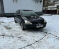 Черный Мицубиси Лансер, объемом двигателя 1.6 л и пробегом 257 тыс. км за 4000 $, фото 1 на Automoto.ua