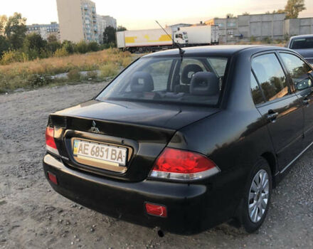 Черный Мицубиси Лансер, объемом двигателя 1.58 л и пробегом 161 тыс. км за 4800 $, фото 4 на Automoto.ua