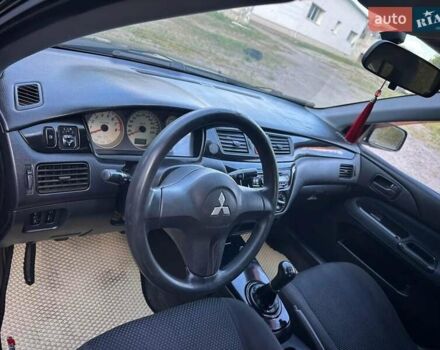 Мицубиси Лансер 2006 в Киеве на Automoto.ua Черный Мицубиси Лансер, объемом двигателя 1.58 л и пробегом 268 тыс. км за 3400 $, фото 18 на Automoto.ua