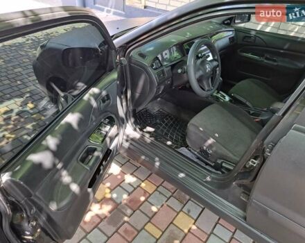 Чорний Міцубісі Lancer, об'ємом двигуна 1.58 л та пробігом 280 тис. км за 3950 $, фото 16 на Automoto.ua