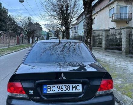 Черный Мицубиси Лансер, объемом двигателя 1.6 л и пробегом 306 тыс. км за 4800 $, фото 4 на Automoto.ua