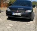 Черный Мицубиси Лансер, объемом двигателя 1.6 л и пробегом 300 тыс. км за 3999 $, фото 1 на Automoto.ua