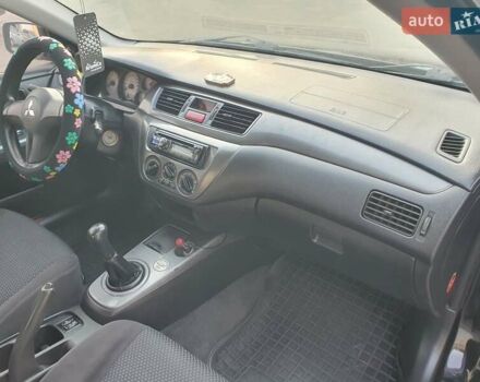 Черный Мицубиси Лансер, объемом двигателя 1.58 л и пробегом 222 тыс. км за 2999 $, фото 16 на Automoto.ua