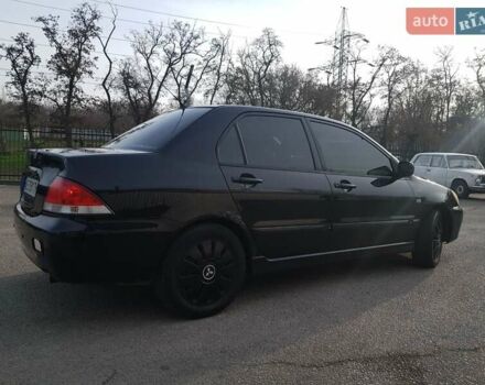 Чорний Міцубісі Lancer, об'ємом двигуна 1.58 л та пробігом 290 тис. км за 3200 $, фото 6 на Automoto.ua