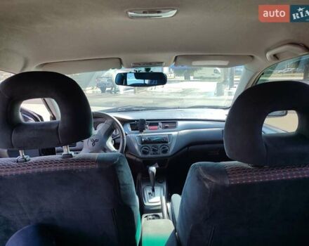 Черный Мицубиси Лансер, объемом двигателя 1.58 л и пробегом 128 тыс. км за 4600 $, фото 11 на Automoto.ua