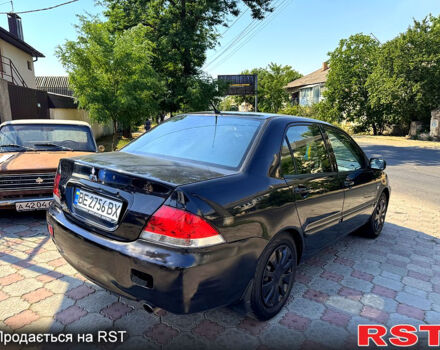 Черный Мицубиси Лансер, объемом двигателя 1.6 л и пробегом 300 тыс. км за 3599 $, фото 6 на Automoto.ua