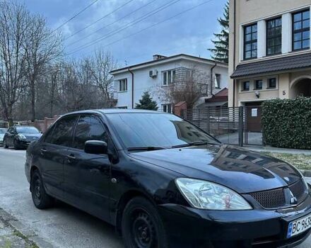 Черный Мицубиси Лансер, объемом двигателя 1.6 л и пробегом 306 тыс. км за 4800 $, фото 2 на Automoto.ua
