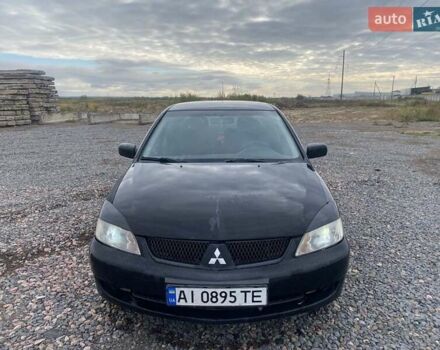 Чорний Міцубісі Lancer, об'ємом двигуна 1.6 л та пробігом 335 тис. км за 3500 $, фото 10 на Automoto.ua