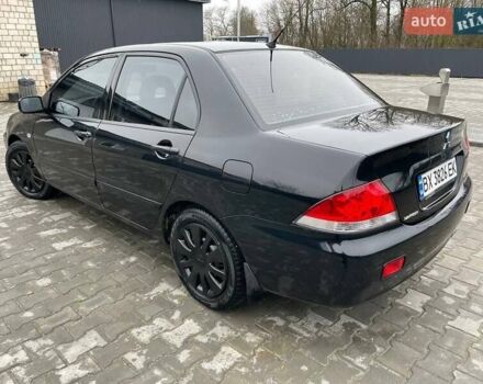 Чорний Міцубісі Lancer, об'ємом двигуна 1.58 л та пробігом 282 тис. км за 4100 $, фото 7 на Automoto.ua