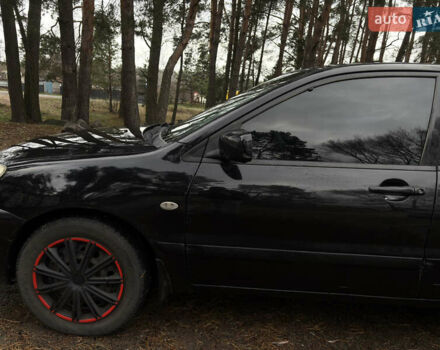 Чорний Міцубісі Lancer, об'ємом двигуна 1.58 л та пробігом 210 тис. км за 3900 $, фото 7 на Automoto.ua