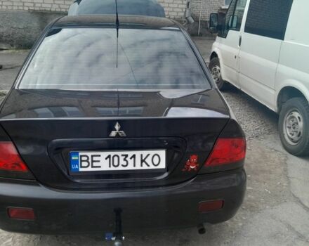 Черный Мицубиси Лансер, объемом двигателя 1.6 л и пробегом 260 тыс. км за 3800 $, фото 5 на Automoto.ua