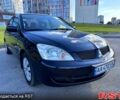 Черный Мицубиси Лансер, объемом двигателя 1.6 л и пробегом 150 тыс. км за 3999 $, фото 1 на Automoto.ua