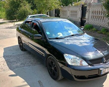 Чорний Міцубісі Lancer, об'ємом двигуна 1.6 л та пробігом 240 тис. км за 5400 $, фото 1 на Automoto.ua
