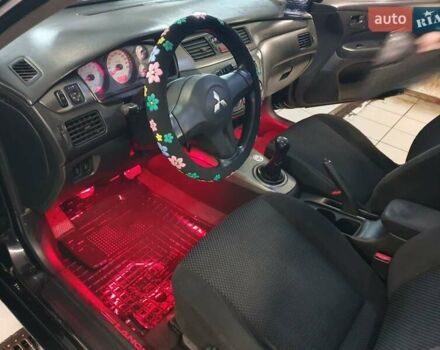 Черный Мицубиси Лансер, объемом двигателя 1.58 л и пробегом 222 тыс. км за 2999 $, фото 24 на Automoto.ua