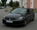 Чорний Міцубісі Lancer, об'ємом двигуна 2 л та пробігом 311 тис. км за 4500 $, фото 1 на Automoto.ua