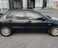 Черный Мицубиси Лансер, объемом двигателя 1.59 л и пробегом 221 тыс. км за 4200 $, фото 1 на Automoto.ua