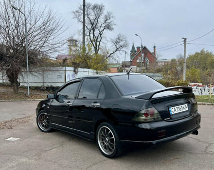 Чорний Міцубісі Lancer, об'ємом двигуна 2 л та пробігом 242 тис. км за 5900 $, фото 4 на Automoto.ua