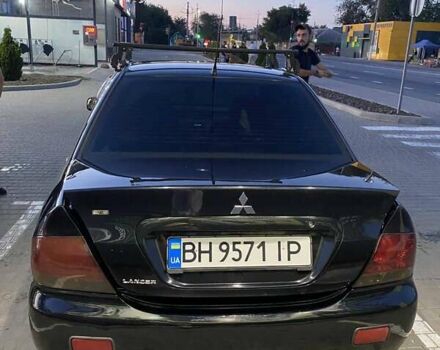Черный Мицубиси Лансер, объемом двигателя 1.6 л и пробегом 257 тыс. км за 4500 $, фото 1 на Automoto.ua