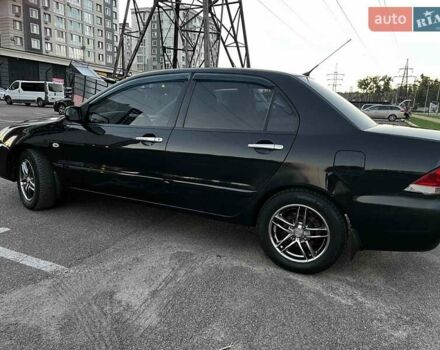 Чорний Міцубісі Lancer, об'ємом двигуна 1.58 л та пробігом 329 тис. км за 3500 $, фото 5 на Automoto.ua