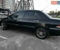 Чорний Міцубісі Lancer, об'ємом двигуна 1.58 л та пробігом 329 тис. км за 3500 $, фото 5 на Automoto.ua