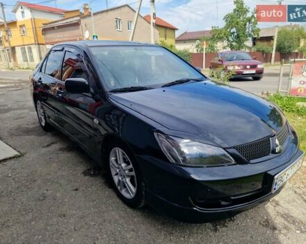 Черный Мицубиси Лансер, объемом двигателя 2 л и пробегом 168 тыс. км за 4999 $, фото 3 на Automoto.ua