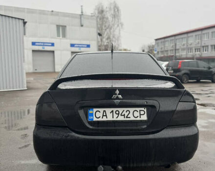 Черный Мицубиси Лансер, объемом двигателя 1.6 л и пробегом 368 тыс. км за 3200 $, фото 4 на Automoto.ua