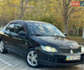 Міцубісі Lancer 2006 у Дніпро (Дніпропетровську) на Automoto.ua Чорний Міцубісі Lancer, об'ємом двигуна 2 л та пробігом 230 тис. км за 4900 $, фото 5 на Automoto.ua
