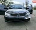 Черный Мицубиси Лансер, объемом двигателя 2 л и пробегом 209 тыс. км за 6800 $, фото 1 на Automoto.ua