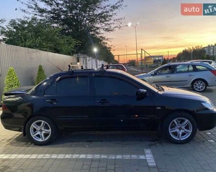 Черный Мицубиси Лансер, объемом двигателя 1.6 л и пробегом 257 тыс. км за 4500 $, фото 5 на Automoto.ua