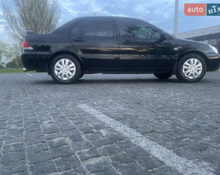 Черный Мицубиси Лансер, объемом двигателя 1.6 л и пробегом 231 тыс. км за 4250 $, фото 4 на Automoto.ua