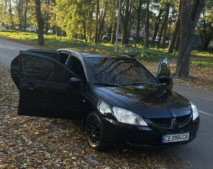Черный Мицубиси Лансер, объемом двигателя 1.6 л и пробегом 233 тыс. км за 3650 $, фото 14 на Automoto.ua
